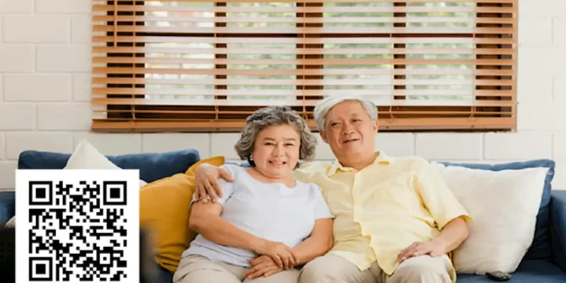 Senior couple in coastal Delaware home with window treatments in background