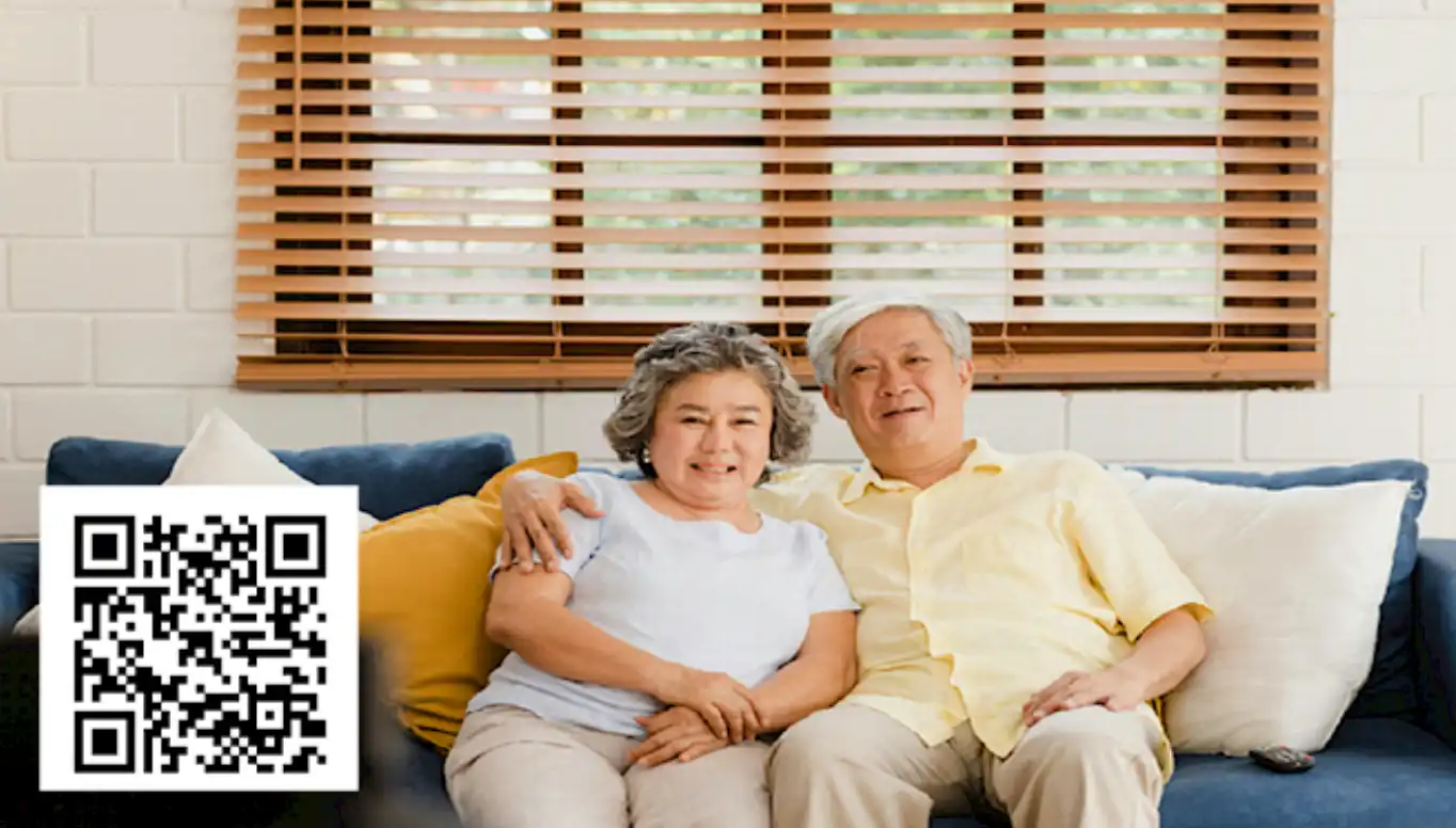 Senior couple in coastal Delaware home with window treatments in background